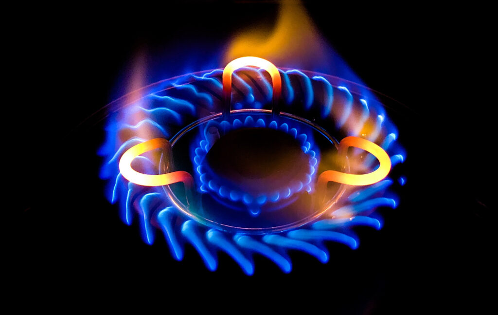 Closeup Shot Of A Beautiful Blue Flame In A Gas Stove