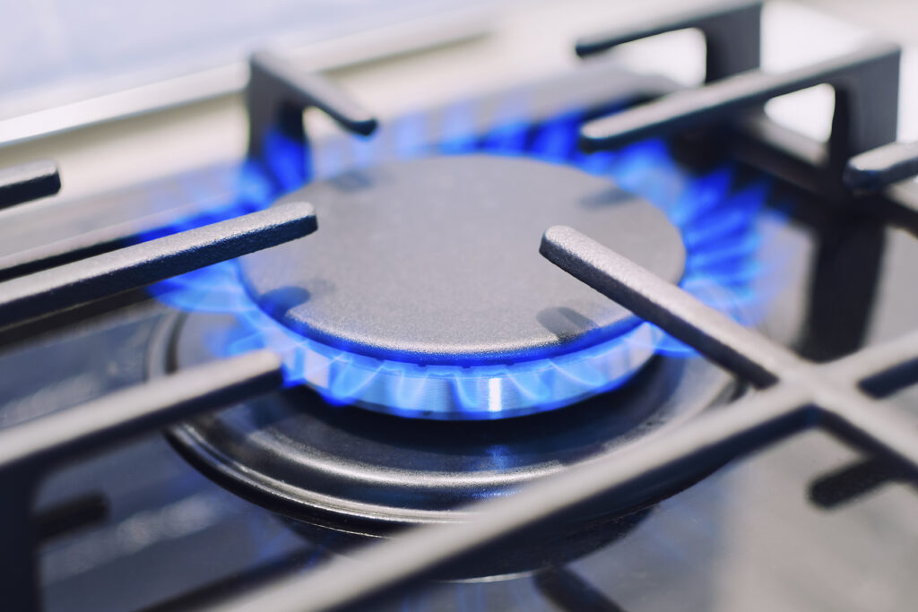 Burning Gas Burner On The Stove. Photo With Shallow Depth Of Fo